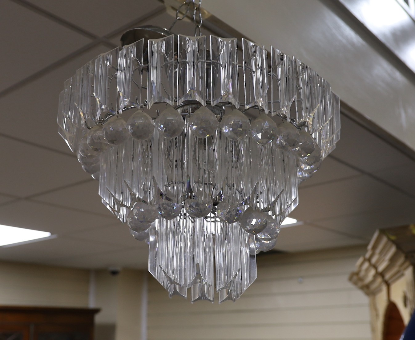 A perspex three tier chandelier